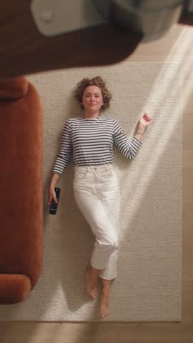 LOOK 01: a striped top and cream trousers, from the photo